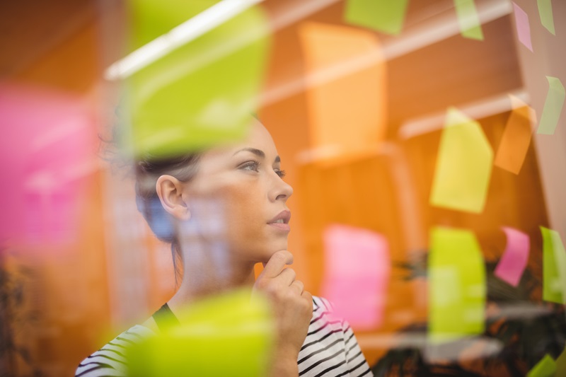 female-executive-reading-sticky-notes-3198315.jpg