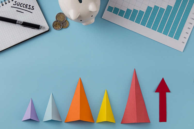 top-view-business-items-with-piggy-bank-growth-cones-739318.jpg